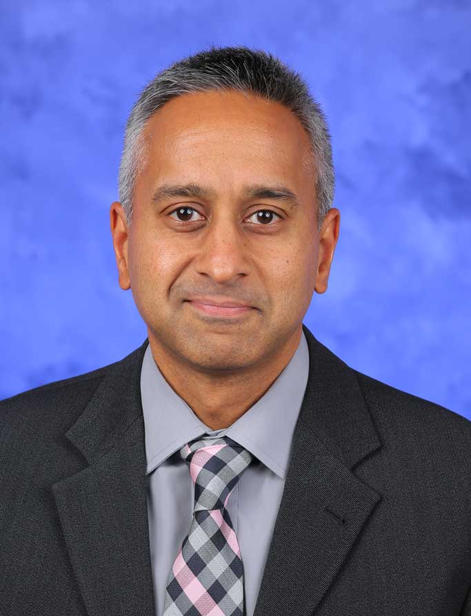 A head-and-shoulders professional photo of Dr. Jay Raman
