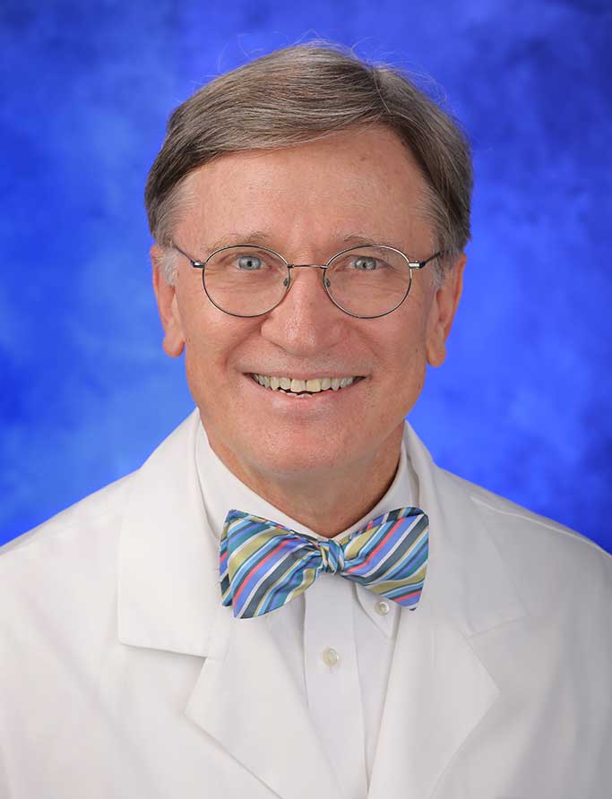 A head-and-shoulders photo of William H. Trescher, MD