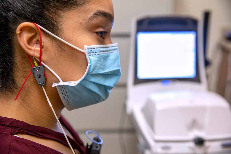 A patient has Real Ear Measurements performed before being fit with a hearing aid.