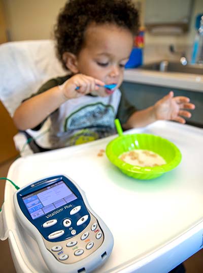 Pediatric patient participates in feeding therapy with neuromuscular electrical stimulation