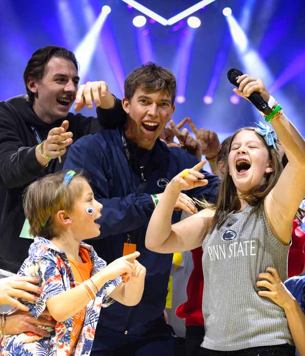 A Four Diamonds child performs to a cheering crowd during the THON talent show.