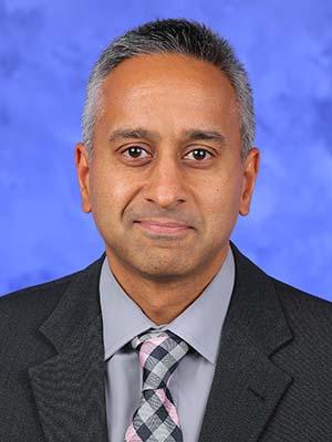 Jay Raman, MD, pictured in a professional head and shoulders photograph