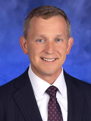 Kyle C. Snyder, professional head and shoulders photograph.