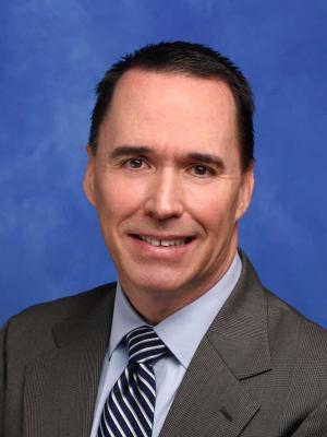 James Leaming, MD, is pictured in a professional head and shoulders photo.