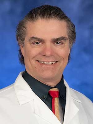 Jason Mills, MD, PhD, professional head and shoulders photograph.