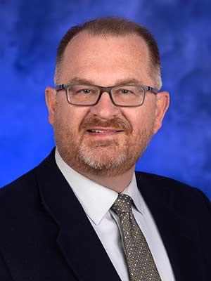 David Simmons, professional head and shoulders photograph.