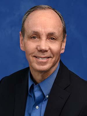 Dr. Bret DeLone is pictured in a professional head and shoulders photo.