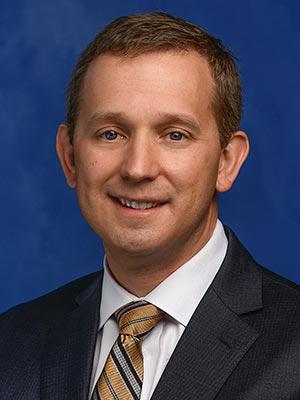 Kyle C. Snyder displayed in a professional head and shoulders photo