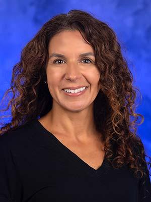 Colette Fisher, MA, professional head and shoulders photograph.