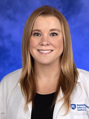 A headshot of a female nurse.