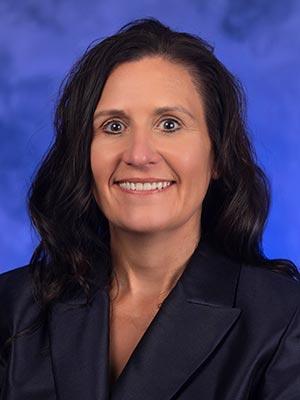 Tracy Moyer in a professional head and shoulders photograph.