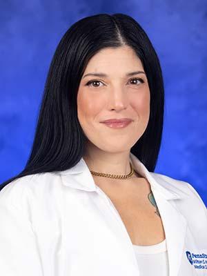 Raquel Misas, professional head and shoulders photograph.