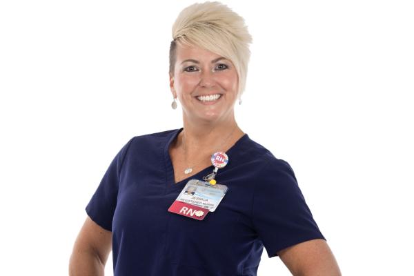 Jess Robinson - Photo of a woman in scrubs.