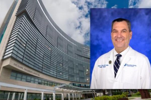 Exterior of Penn State Health Children’s Hospital Golisano Children’s Hospital, with a portrait of pediatric surgeon Dr. Robert Ricca inset in the upper right.