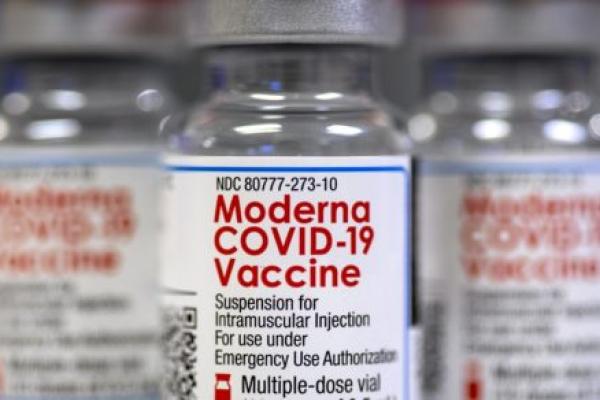 An up-close photo of a vial of the Moderna COVID-19 vaccine.