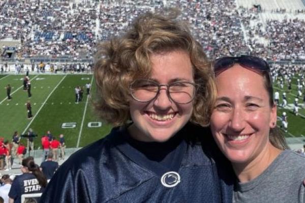 Caryn Thurman and Susan Thurman pose in the stands of the Penn State University football stadium on Sept. 11.