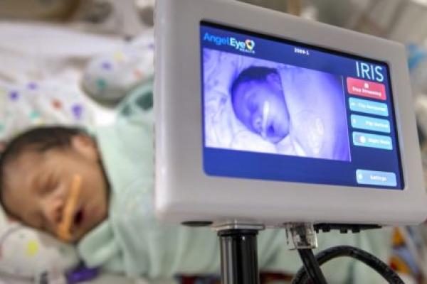 A baby is shown on the monitor of an electronic device.