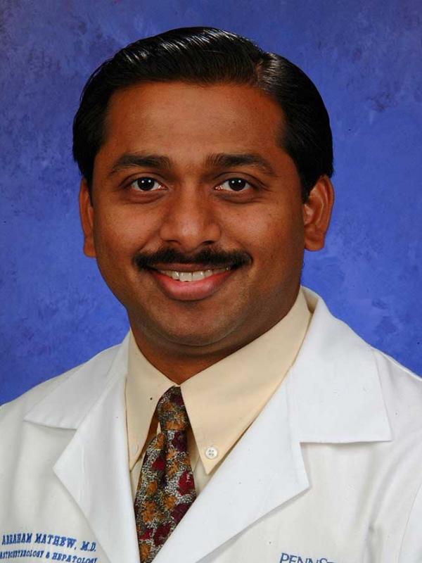 A head-and-shoulders photo of Abraham Mathew, MD