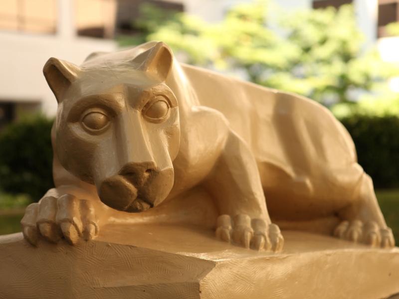 The nittany lion statue facing the camera.