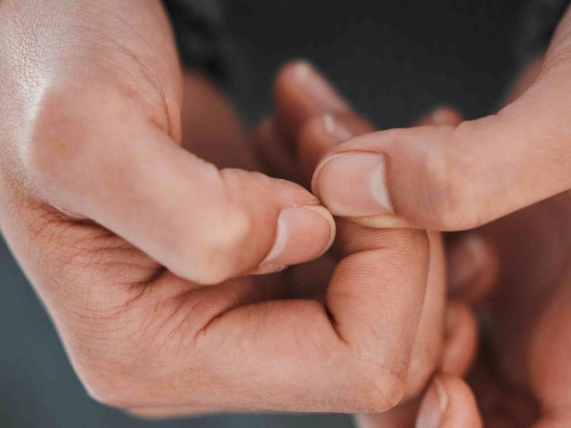 Close-up of a person holding their hands close together.