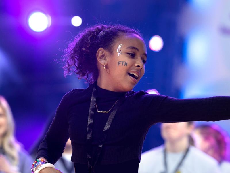  Four Diamonds child Charlize Curry performs during the talent show at THON in the Bryce Jordan Center on Saturday, Feb. 18, 2023.