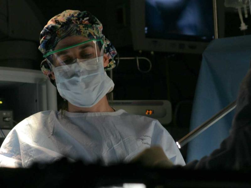 Surgeon in the operating room performing robotic surgery